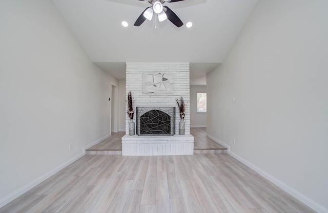 12407 Big Oaks Dr, Houston, TX 77050 - unfurnished living room with a fireplace, a ceiling fan, light wood finished floors, and vaulted ceiling