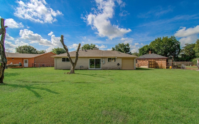 12407 Big Oaks Dr, Houston, TX 77050 - rear view of house with a garage, a fenced backyard, and brick siding