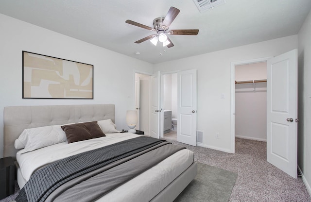 12407 Big Oaks Dr, Houston, TX 77050 - bedroom featuring carpet, a walk in closet, ceiling fan, a closet, and ensuite bath