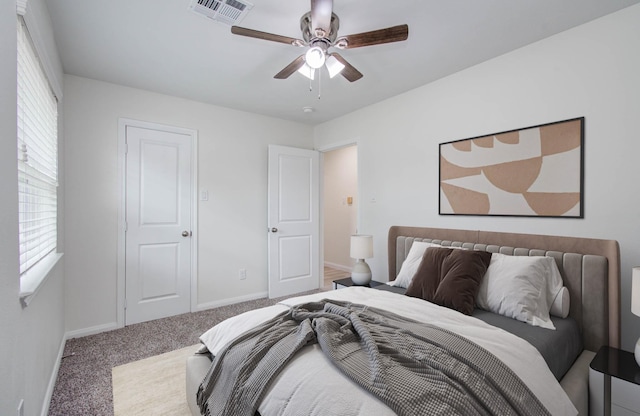12407 Big Oaks Dr, Houston, TX 77050 - bedroom featuring multiple windows, carpet, and ceiling fan