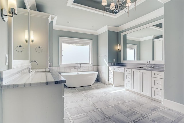8015 Serenity Ct, Houston, TX 77025 - full bath with plenty of natural light, vanity, a freestanding bath, a chandelier, and ornamental molding