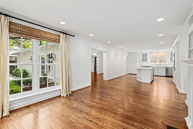 2105 Del Monte Dr, Houston, TX 77019 - unfurnished living room with plenty of natural light, wood finished floors, crown molding, and recessed lighting