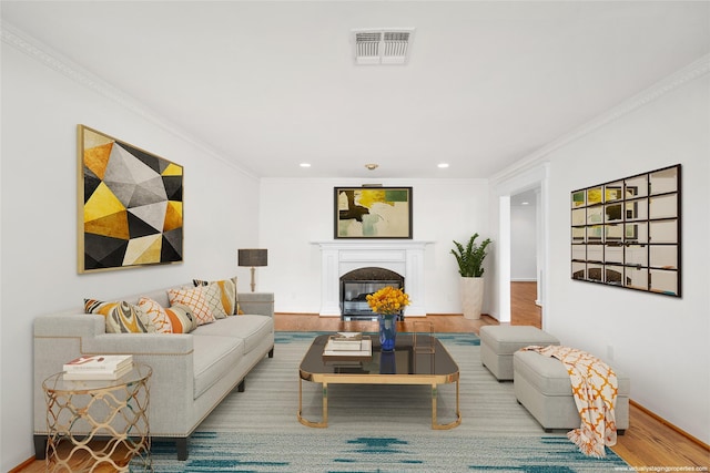 2105 Del Monte Dr, Houston, TX 77019 - living area featuring wood finished floors, recessed lighting, crown molding, and a glass covered fireplace
