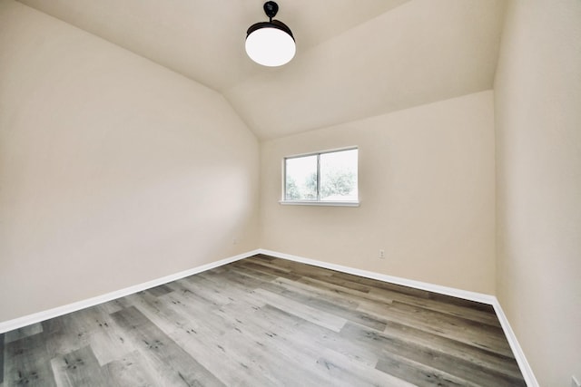 6902 Sterling Meadow Dr, Katy, TX 77449 - unfurnished room with lofted ceiling and wood finished floors