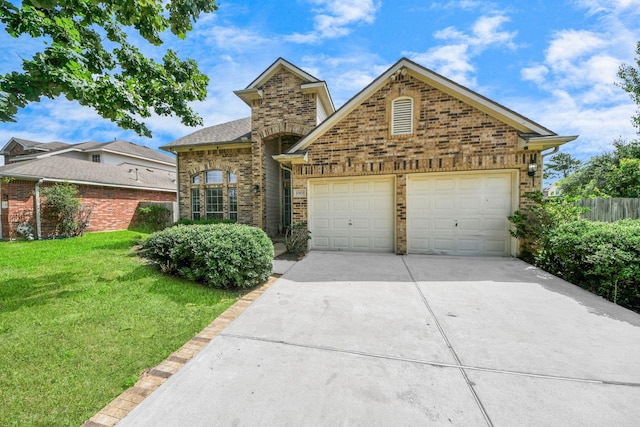 6902 Sterling Meadow Dr, Katy, TX 77449 - traditional-style house with driveway, a front yard, an attached garage, and brick siding