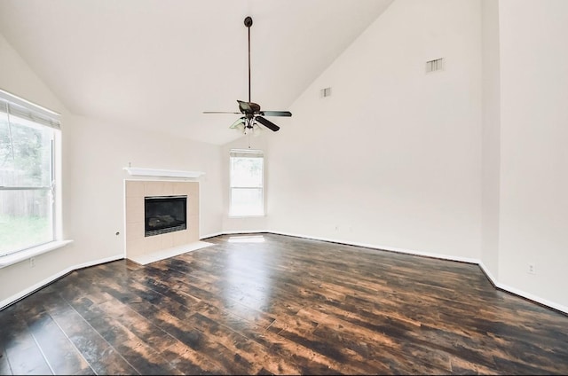 6902 Sterling Meadow Dr, Katy, TX 77449 - unfurnished living room featuring wood finished floors, ceiling fan, a fireplace, and high vaulted ceiling