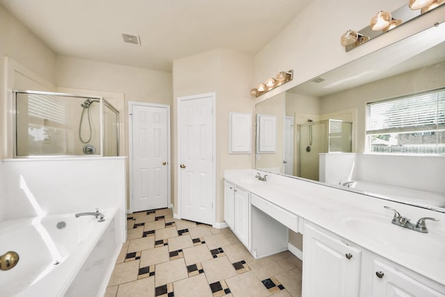 6902 Sterling Meadow Dr, Katy, TX 77449 - full bathroom with a garden tub, a stall shower, double vanity, and tile patterned floors