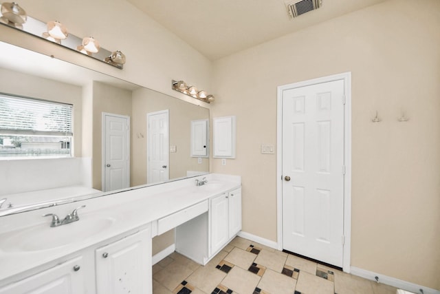 6902 Sterling Meadow Dr, Katy, TX 77449 - bathroom featuring double vanity, tile patterned floors, and a tub to relax in