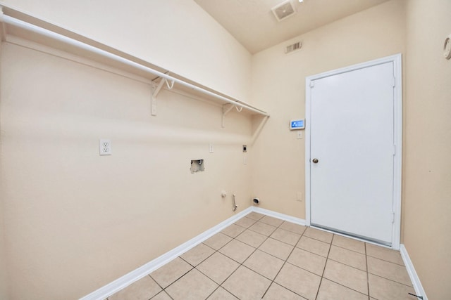 6902 Sterling Meadow Dr, Katy, TX 77449 - laundry area featuring hookup for a gas dryer, electric dryer hookup, hookup for a washing machine, and light tile patterned flooring