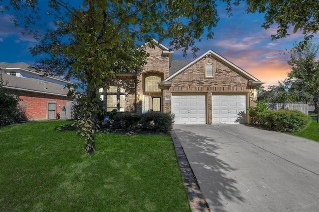 6902 Sterling Meadow Dr, Katy, TX 77449 - view of front facade with a garage, driveway, and brick siding