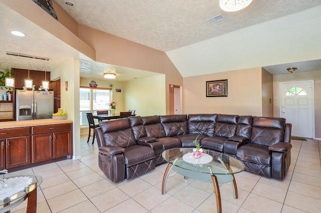 4318 Glen Avon Dr, Pasadena, TX 77505 - living room with a textured ceiling, light tile patterned flooring, and lofted ceiling