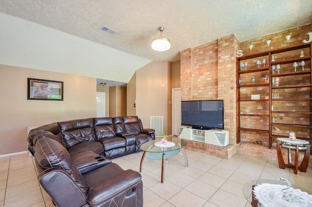 4318 Glen Avon Dr, Pasadena, TX 77505 - living room featuring vaulted ceiling, light tile patterned flooring, and a textured ceiling