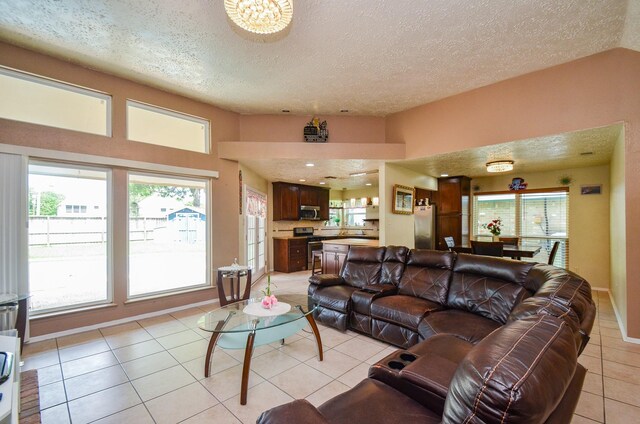4318 Glen Avon Dr, Pasadena, TX 77505 - living room with light tile patterned floors, plenty of natural light, and a textured ceiling