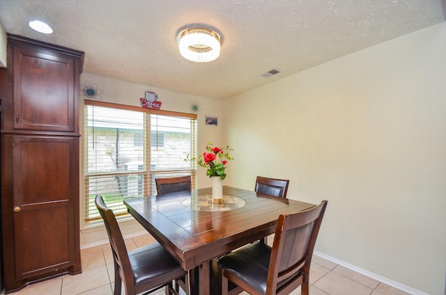 4318 Glen Avon Dr, Pasadena, TX 77505 - dining space with light tile patterned floors and a textured ceiling