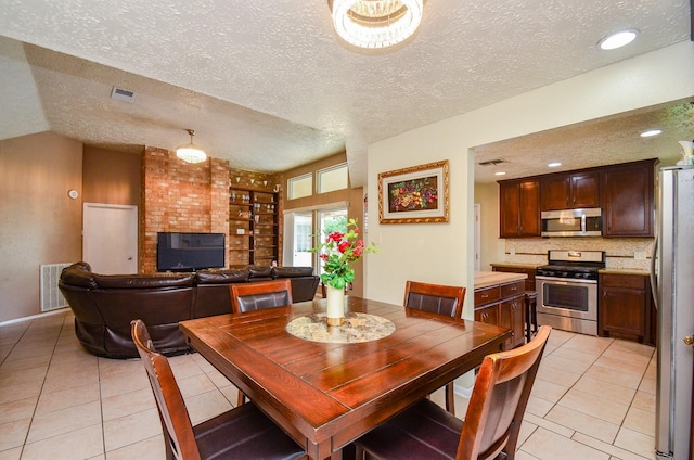 4318 Glen Avon Dr, Pasadena, TX 77505 - dining area with light tile patterned flooring and a textured ceiling