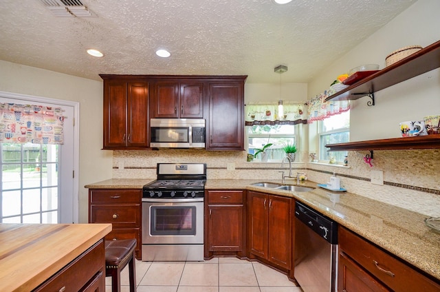 4318 Glen Avon Dr, Pasadena, TX 77505 - kitchen featuring appliances with stainless steel finishes, open shelves, decorative backsplash, light tile patterned floors, and a textured ceiling
