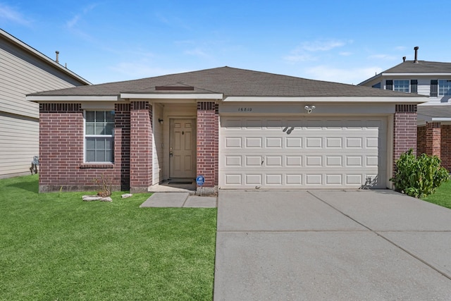 16810 Perryton Ln, Houston, TX 77073 - view of front of house featuring brick siding, concrete driveway, a front lawn, and a garage