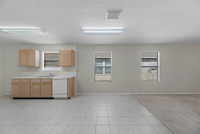 16810 Perryton Ln, Houston, TX 77073 - kitchen with dishwasher, healthy amount of natural light, light countertops, and a textured ceiling
