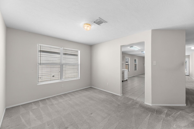 16810 Perryton Ln, Houston, TX 77073 - empty room featuring light carpet and light tile patterned floors
