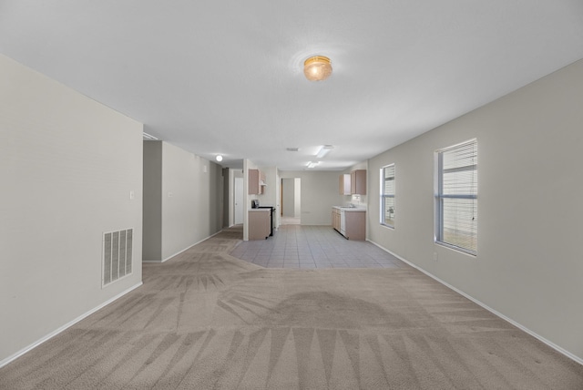 16810 Perryton Ln, Houston, TX 77073 - unfurnished living room featuring light colored carpet and light tile patterned floors