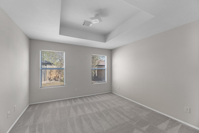 16810 Perryton Ln, Houston, TX 77073 - carpeted spare room with baseboards and a tray ceiling