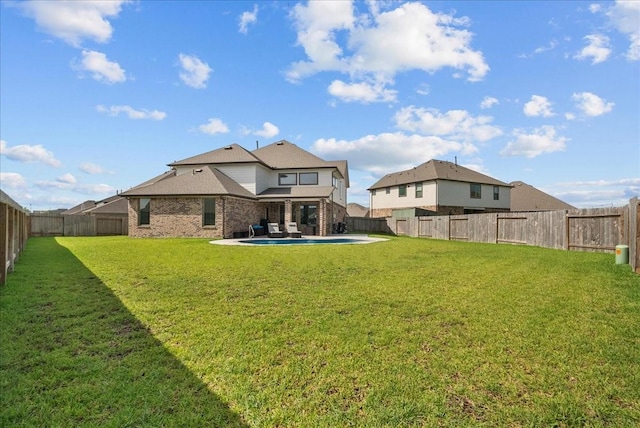 6214 Bois D Arc St, League City, TX 77573 - rear view of house featuring a fenced backyard, brick siding, and a patio
