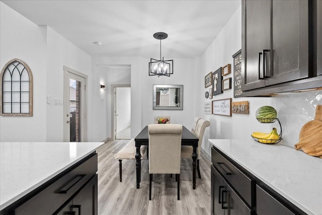 6214 Bois D Arc St, League City, TX 77573 - dining space featuring a chandelier and light wood-type flooring