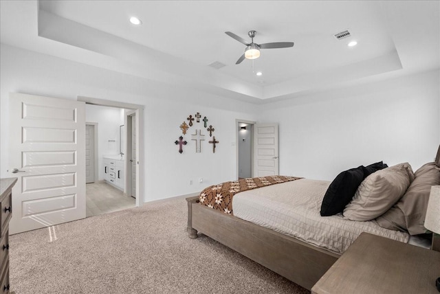 6214 Bois D Arc St, League City, TX 77573 - bedroom with a tray ceiling, light colored carpet, recessed lighting, connected bathroom, and ceiling fan