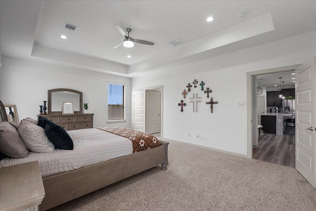 6214 Bois D Arc St, League City, TX 77573 - carpeted bedroom featuring a raised ceiling, stainless steel fridge with ice dispenser, recessed lighting, and a ceiling fan