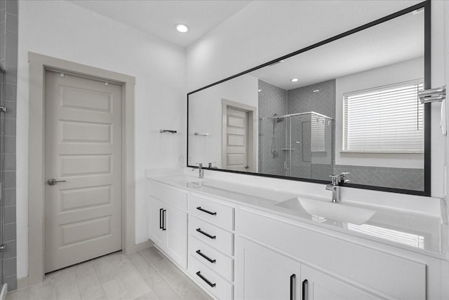 6214 Bois D Arc St, League City, TX 77573 - full bathroom with a shower stall, double vanity, and recessed lighting