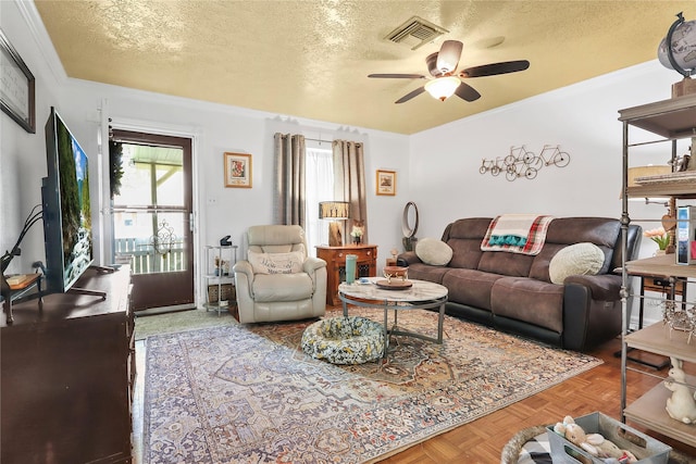 826 Ivyhollow Dr, Channelview, TX 77530 - living room with ceiling fan and a textured ceiling