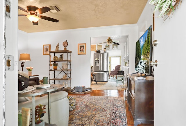 826 Ivyhollow Dr, Channelview, TX 77530 - living room featuring a ceiling fan, wood finished floors, and crown molding