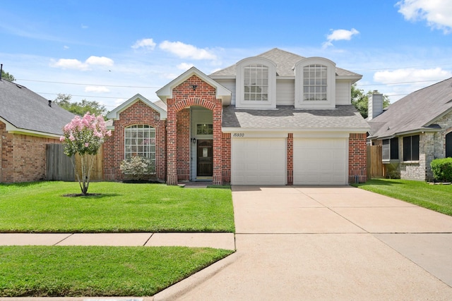 15930 Oak Mountain Dr, Houston, TX 77095 - view of front of house with brick siding, roof with shingles, driveway, and a garage