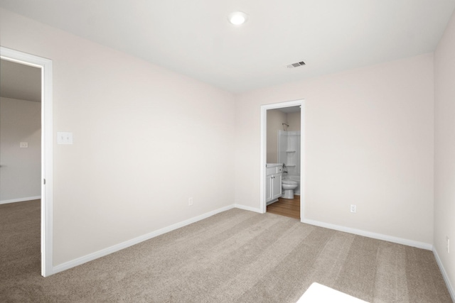 10360 Sweetwater Creek Dr, Cleveland, TX 77328 - unfurnished bedroom with carpet, ensuite bathroom, and recessed lighting