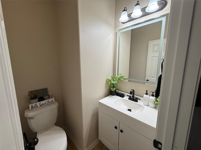 9022 Saint Laurent Ln, Houston, TX 77044 - bathroom with vanity and a textured wall
