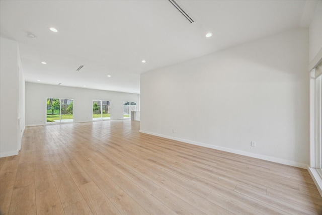 10225 Shadow Oaks Dr, Houston, TX 77043 - spare room featuring recessed lighting, light wood-style flooring, and a smoke detector
