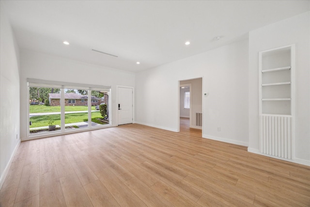 10225 Shadow Oaks Dr, Houston, TX 77043 - empty room featuring light wood-style flooring, recessed lighting, and built in shelves
