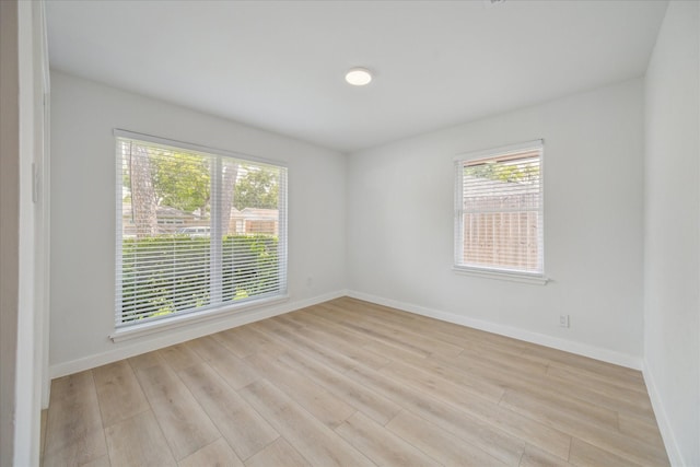 10225 Shadow Oaks Dr, Houston, TX 77043 - empty room featuring healthy amount of natural light and light wood finished floors