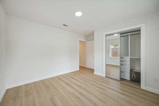 10225 Shadow Oaks Dr, Houston, TX 77043 - unfurnished bedroom with light wood-style flooring and a closet