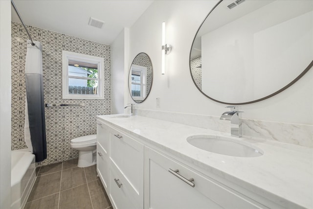 10225 Shadow Oaks Dr, Houston, TX 77043 - bathroom with double vanity, tile patterned floors, shower / bath combination with curtain, and tile walls
