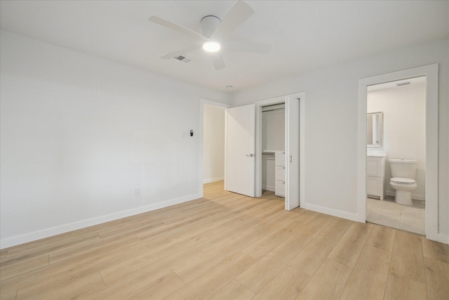 10225 Shadow Oaks Dr, Houston, TX 77043 - unfurnished bedroom with light wood-style flooring, a closet, ensuite bath, and ceiling fan