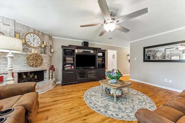 1926 Meadow Creek Dr, Pearland, TX 77581 - living area with a ceiling fan, light wood-style flooring, crown molding, and a brick fireplace