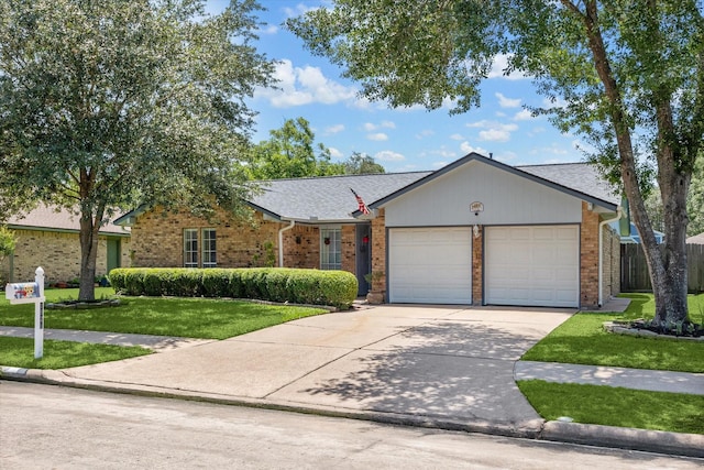 1926 Meadow Creek Dr, Pearland, TX 77581 - ranch-style house with a front lawn, an attached garage, driveway, and brick siding