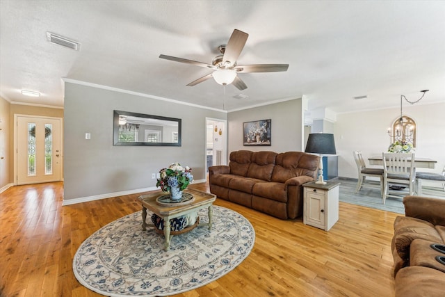 1926 Meadow Creek Dr, Pearland, TX 77581 - living room with light wood finished floors, a ceiling fan, crown molding, and a chandelier