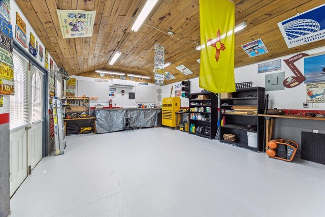 1926 Meadow Creek Dr, Pearland, TX 77581 - garage featuring a workshop area, an AC wall unit, and wood ceiling