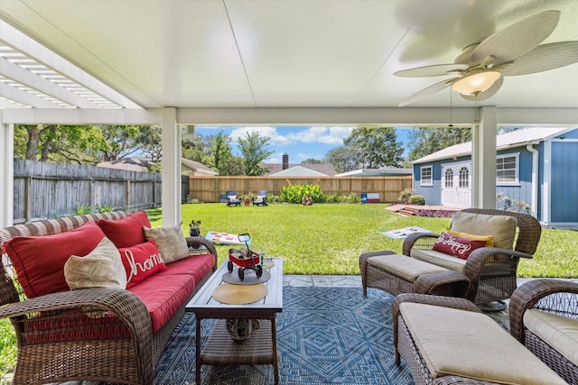 1926 Meadow Creek Dr, Pearland, TX 77581 - fenced backyard featuring outdoor lounge area, a ceiling fan, and an outdoor structure