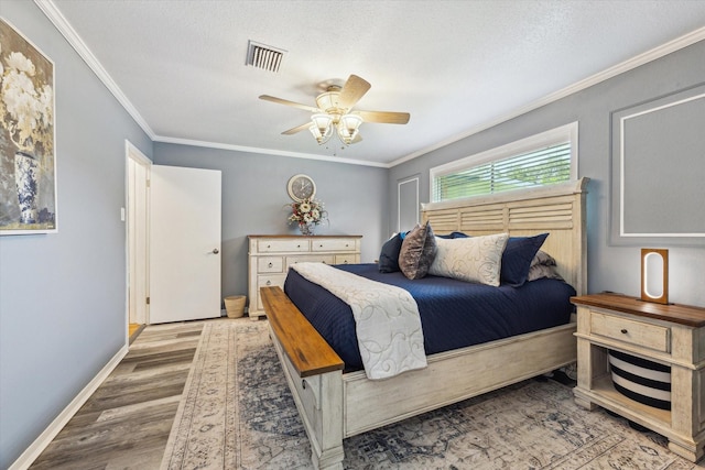 1926 Meadow Creek Dr, Pearland, TX 77581 - bedroom featuring wood finished floors, ornamental molding, ceiling fan, and a textured ceiling