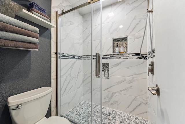1926 Meadow Creek Dr, Pearland, TX 77581 - bathroom featuring a shower stall and a textured wall