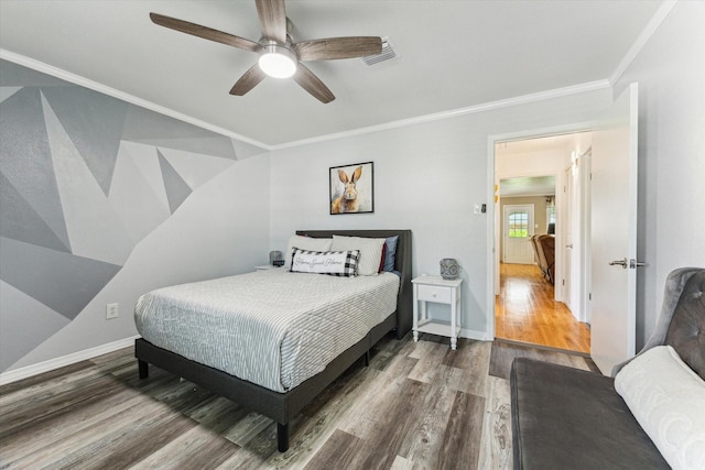 1926 Meadow Creek Dr, Pearland, TX 77581 - bedroom with wood finished floors, ornamental molding, and ceiling fan