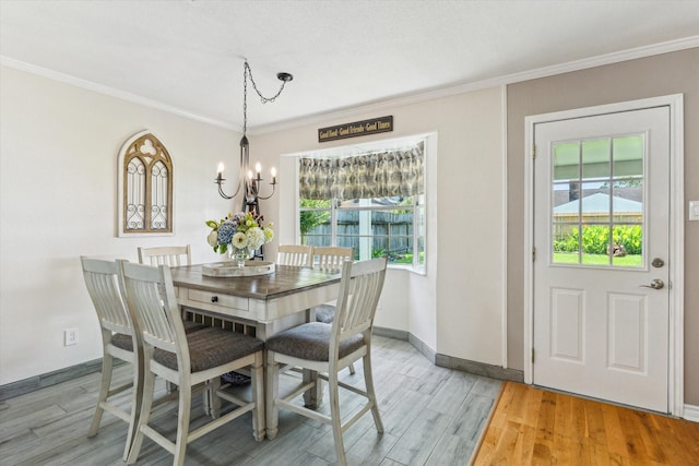 1926 Meadow Creek Dr, Pearland, TX 77581 - dining area featuring plenty of natural light, a chandelier, crown molding, and light wood-type flooring